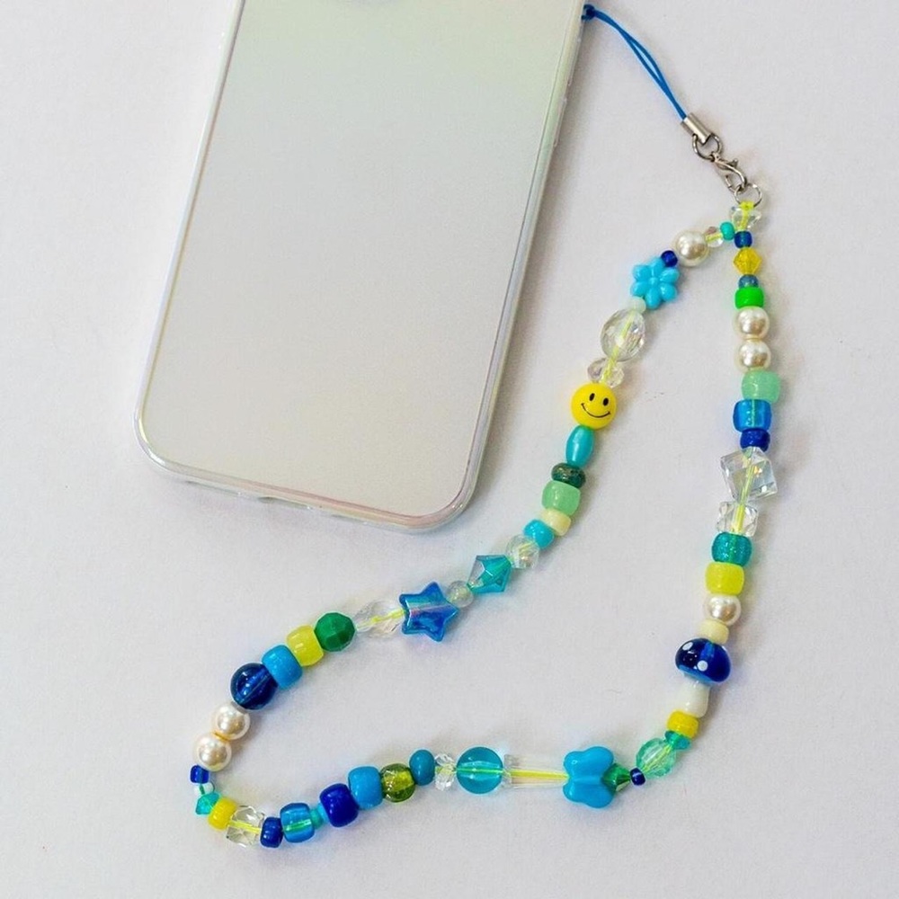 Hand made, one of a kind y2k beaded cell phone sun catcher charm.